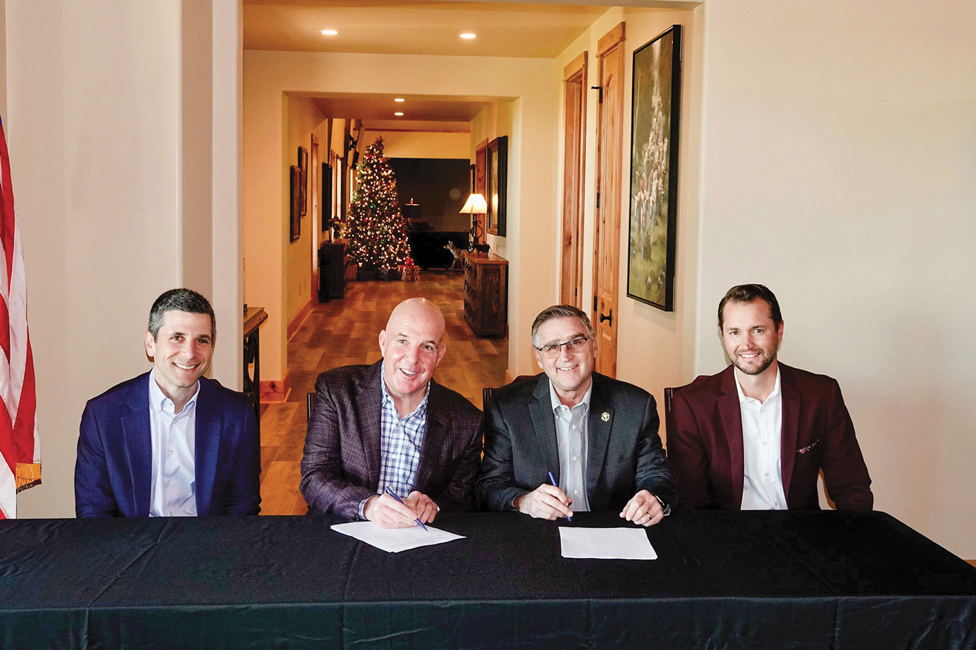International President Kenneth W. Cooper signs a project labor agreement for a $1.3 billion, 580-mile high-voltage DC transmission line with executives from project developer Pattern Energy and parent company Quanta Services. It is the largest outside branch PLA in decades.