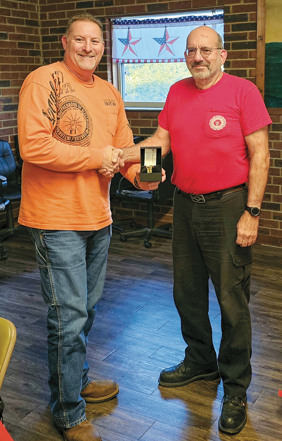 Local 1042 member Brother Mike Schmidt receiving his retirement watch.