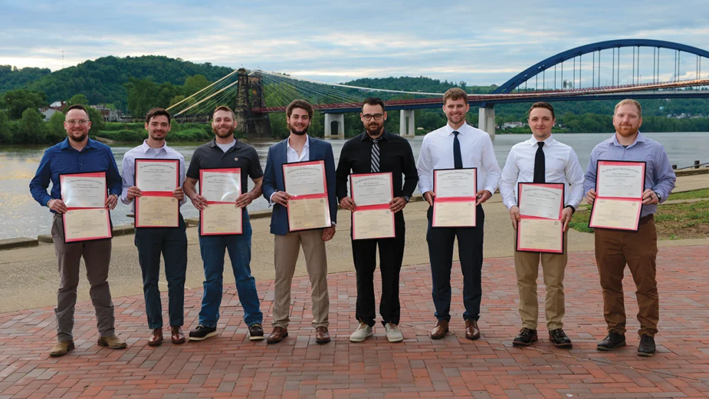 Local 141’s newest journeyman wiremen: from left, Jonny Jacobsen, Kylor Basich, William Garamella, Max Mendelson, Brenden Duncan, Kyle Reilly, Cameron Ross and Nolan Kirchner. (Not pictured: Jackson Palkovic.)