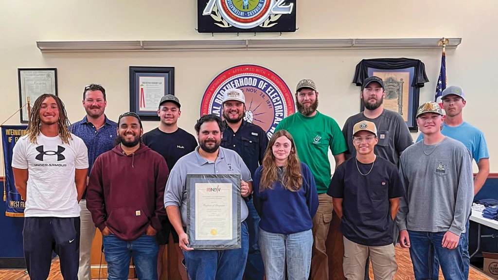 Members of Local 702’s RENEW Committee display their Certificate of Recognition.