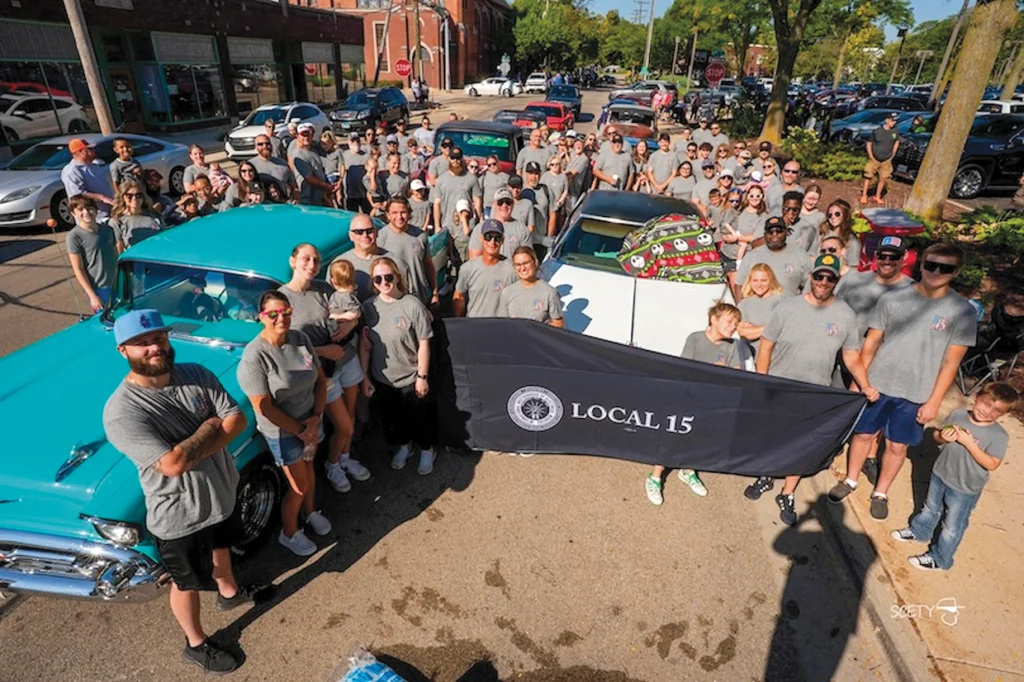 Utility workers and their families from Downers Grove-based Local 15 marched — or in the case of one member’s son, steered — their way through downtown Rockford, Ill.