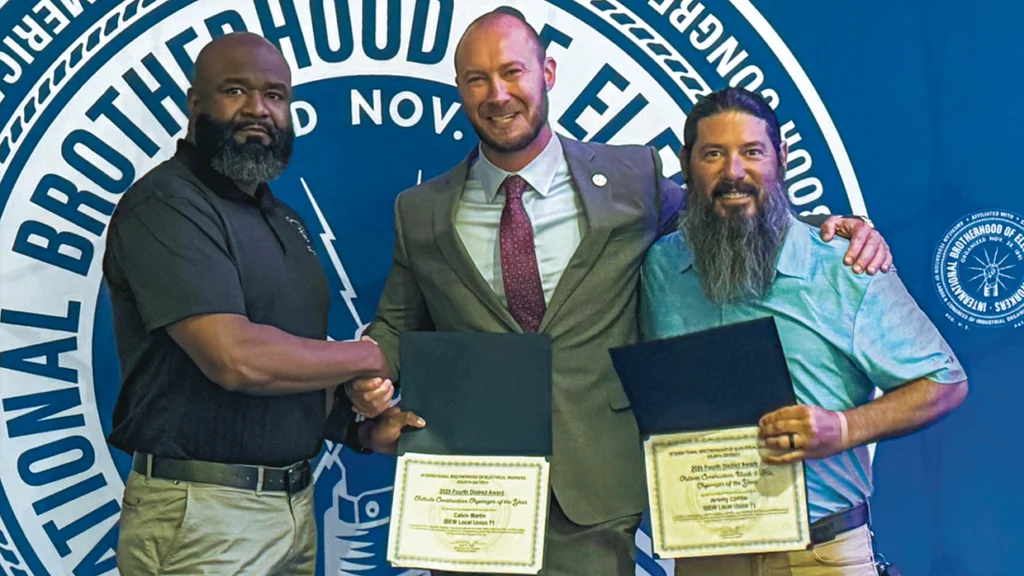 Local 71’s Calvin Martin and Jeremy Combs with Fourth District International Vice President Austin Keyser, center.