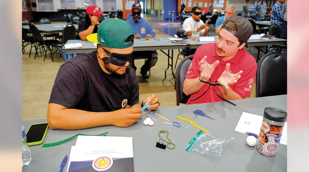 During the IGNITE Knowledge Workshop, Local 357 members Lee Richey and Eugene Catanzaro teamed up to build a safe egg-drop container, one working without the use of his hands, the other without sight.