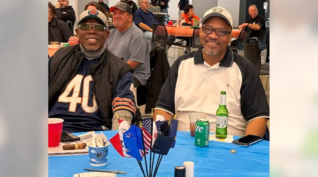 At an event hosted by RENEW members, Local 134 retirees and veterans celebrate a Chicago Bears win at the hall.