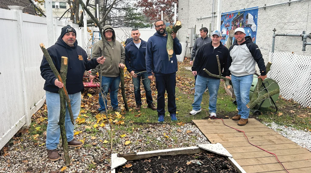 After bad weather, Local 1049 members helped clear the Pronto garden of debris so that the mural dedication could go on.